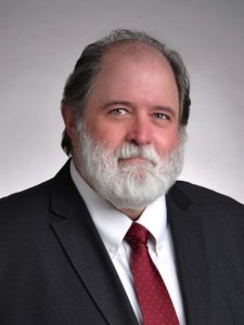 Attorney Mike McDermott in suit and tie